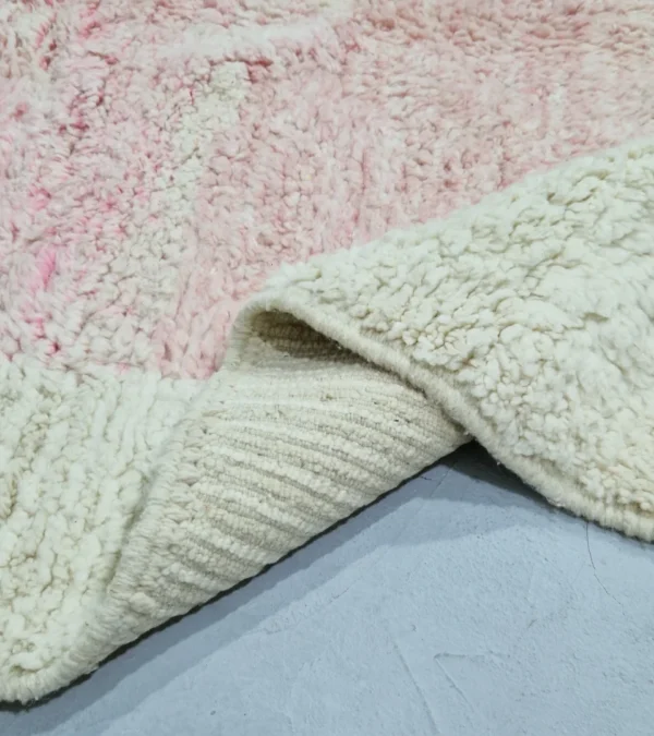 Detailed View of Handmade Moroccan wool rug with an abstract colorblock design in pink, yellow, and black