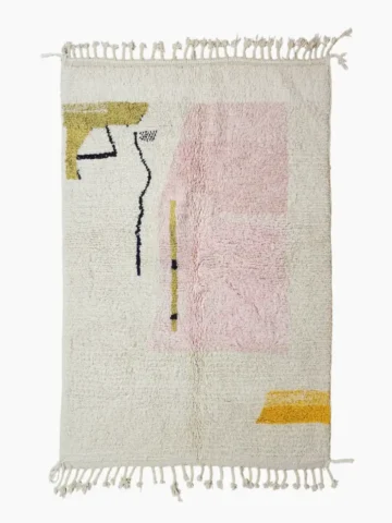 Top View of Handmade Moroccan wool rug with an abstract colorblock design in pink, yellow, and black