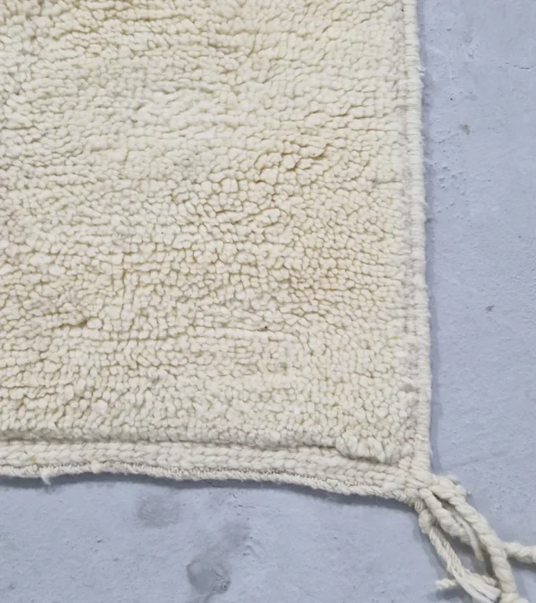 Detailed View of Handmade Beni Ourain wool runner with a minimalist lattice design created by high-low pile in ivory