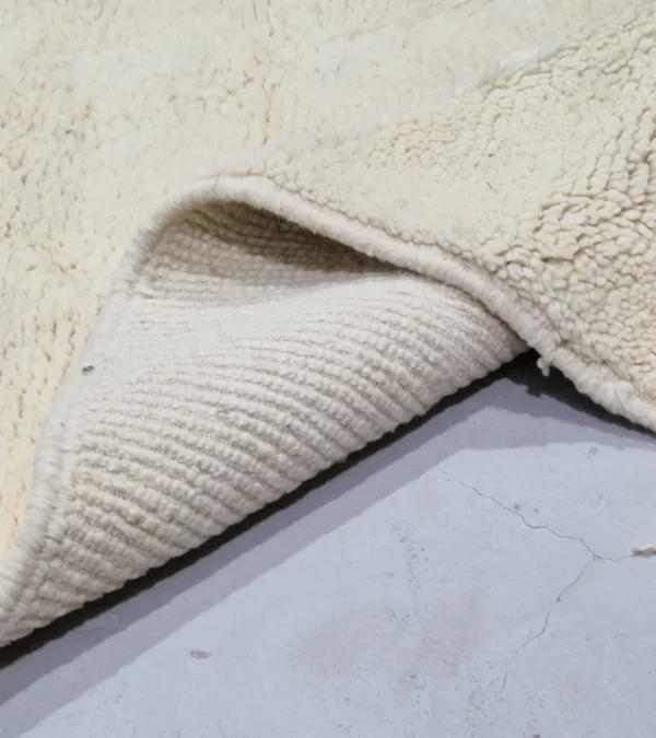 Detailed View of Handmade Beni Ourain wool runner with a minimalist lattice design created by high-low pile in ivory