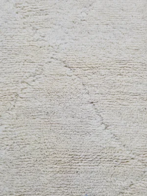 Detailed View of Handmade Beni Ourain wool runner with a minimalist lattice design created by high-low pile in ivory