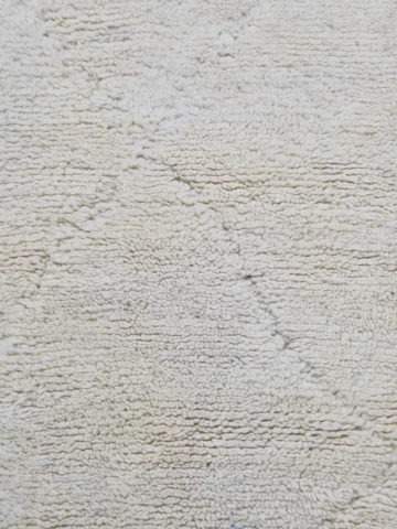 Detailed View of Handmade Beni Ourain wool runner with a minimalist lattice design created by high-low pile in ivory