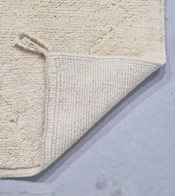 Detailed View of Handmade Beni Ourain wool runner with a minimalist lattice design created by high-low pile in ivory