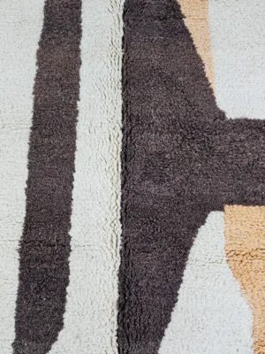 Detailed View of Mira handmade Moroccan wool rug with a modern geometric abstract design in brown and beige