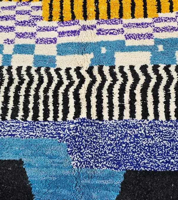 Detailed View of Nareen handmade Beni Mrirt wool rug with a contemporary bohemian abstract geometric design in blue, yellow, and black