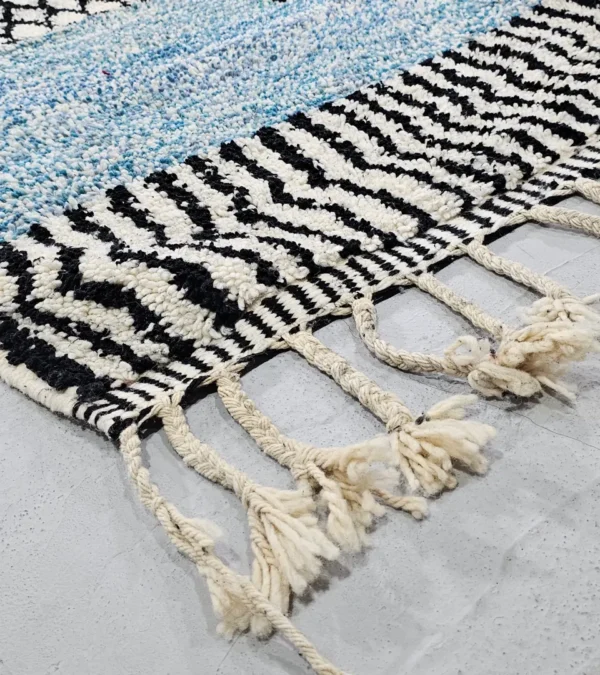 Detailed View of Nareen handmade Beni Mrirt wool rug with a contemporary bohemian abstract geometric design in blue, yellow, and black