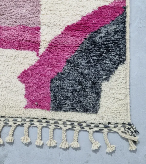 Detailed View of Naya handmade Beni Ourain wool rug with a contemporary abstract design in shades of pink and gray