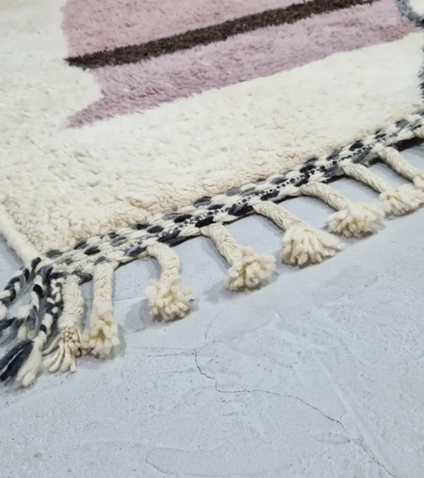 Detailed View of Naya handmade Beni Ourain wool rug with a contemporary abstract design in shades of pink and gray