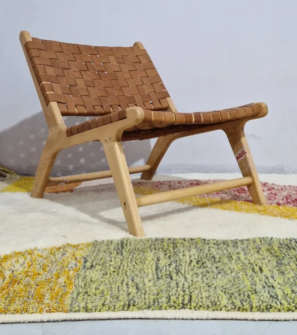 Naya handmade Azilal wool rug with a contemporary color blocks design in yellow, green, pink, brown, and ivory in room