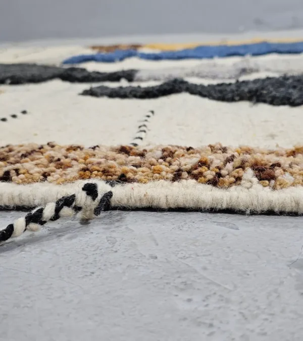 Zoomed In View of Nayla handmade Beni Ourain wool rug with an abstract geometric design in a multicolor palette