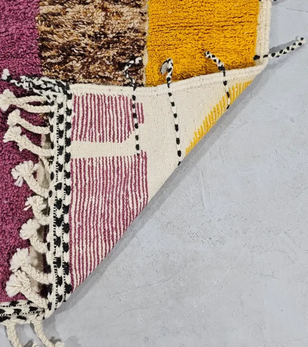 Detailed View of Nayla handmade Beni Ourain wool rug with an abstract geometric design in a multicolor palette