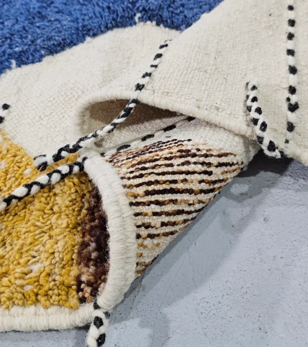 Detailed View of Nayla handmade Beni Ourain wool rug with an abstract geometric design in a multicolor palette