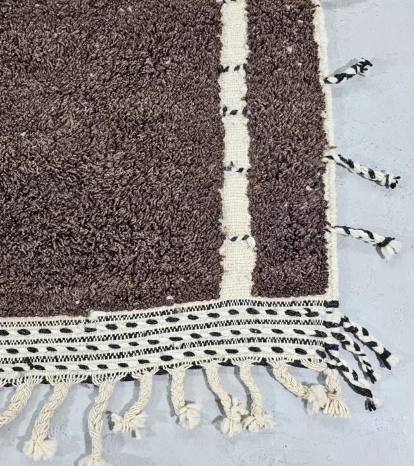 Detailed VIew of Nayla handmade Beni Ourain wool rug with a vibrant multicolor geometric design and a high/low textured pile