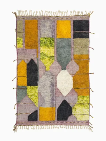 Top View of Nayla handmade Azilal wool rug with a bohemian geometric patchwork design in multiple colors including purple, yellow, gray, black, cream, brown, and green
