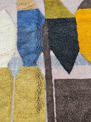 Detailed View of Nayla handmade Beni Ourain wool rug with a colorful geometric design and tassels