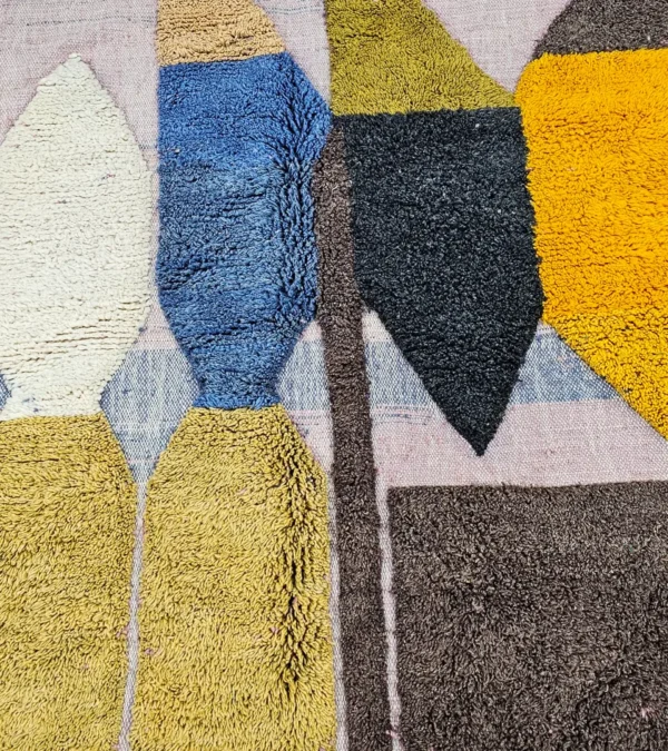 Detailed View of Nayla handmade Beni Ourain wool rug with a colorful geometric design and tassels