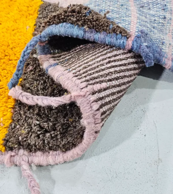 Detailed View of Nayla handmade Beni Ourain wool rug with a colorful geometric design and tassels