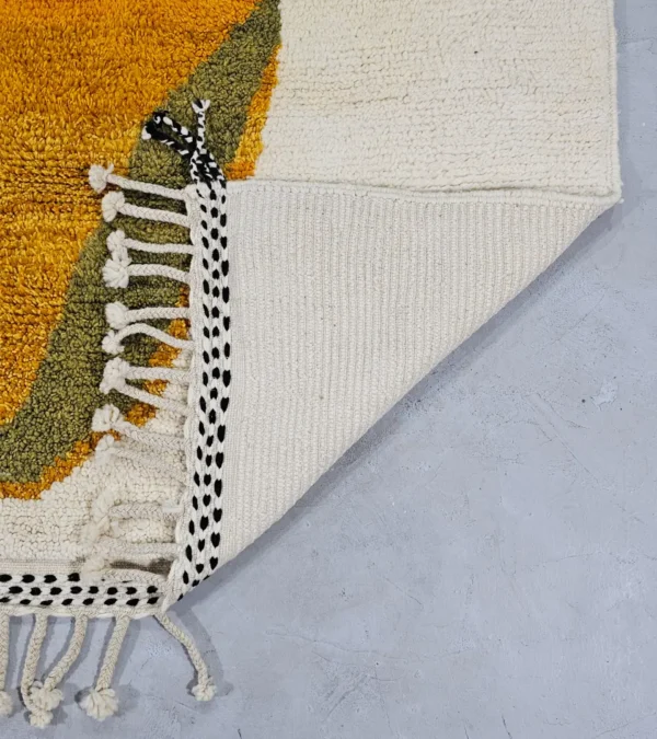 Detailed View of Neo handmade Beni Ourain wool rug with a bold abstract design in mustard yellow and olive green