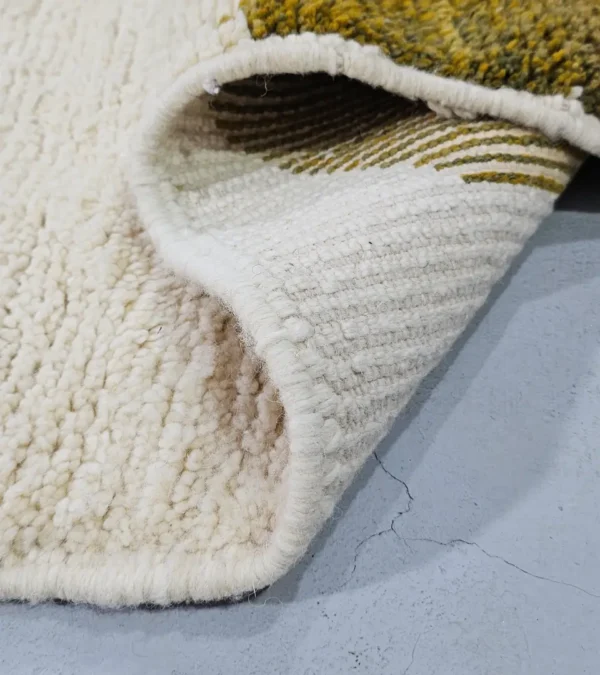 Detailed View of Neo handmade Beni Ourain wool rug with a bold abstract design in mustard yellow and olive green