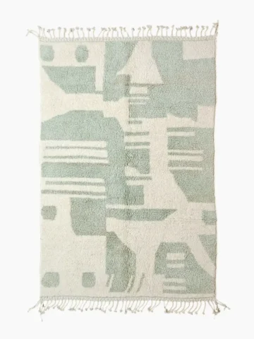 Top View of Handmade Moroccan rug with a modern abstract interlocking geometric design in neon green and off-white