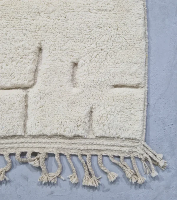 Detailed View of Handmade Moroccan wool rug in cream with raised abstract rectangles