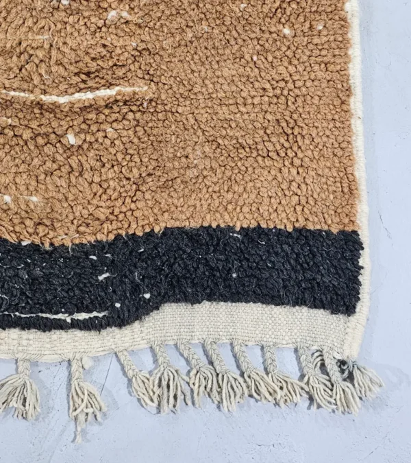 Detailed View of Nova handmade Beni Ourain wool rug with a contemporary curves design in navy blue, brown, mustard yellow, and ivory