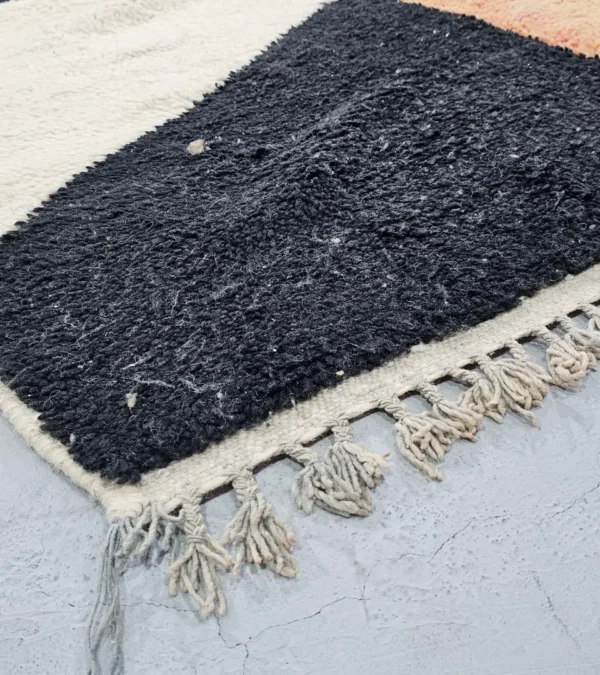 Detailed View of Nova handmade Beni Ourain wool rug with a contemporary curves design in navy blue, brown, mustard yellow, and ivory