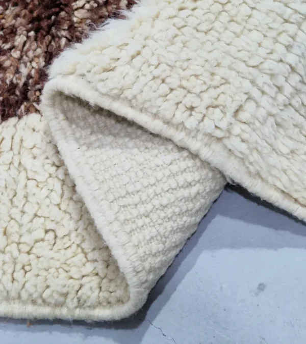 Detailed View of Orin handmade Beni Mrirt wool runner with an abstract diamond design in brown, green, and ivory