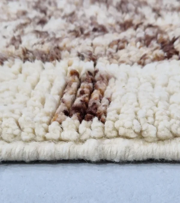 Zoomed In View of Orin handmade Beni Mrirt wool runner with an abstract diamond design in brown, green, and ivory