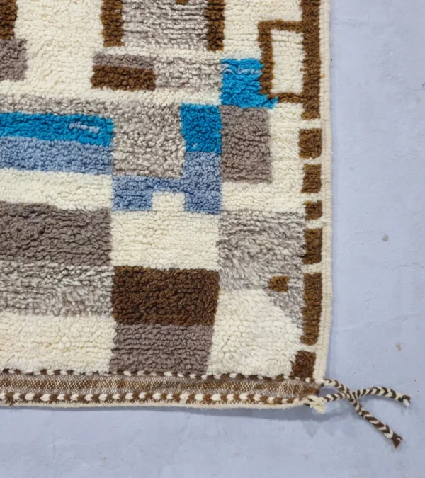 Detailed View of Orin handmade Azilal wool rug with an abstract linear design in gray, brown, ivory, and light blue