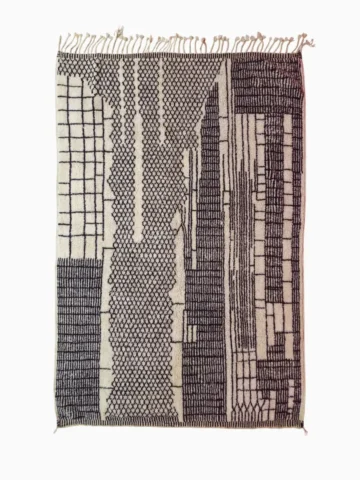 Top View of Riad handmade Moroccan wool rug with an intricate black and ivory textured design