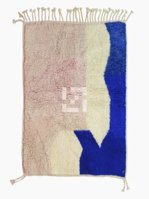 Top View of Rima handmade Beni Ourain wool rug with a contemporary abstract design in multicolor hues including blush pink, off-white, and royal blue to indigo