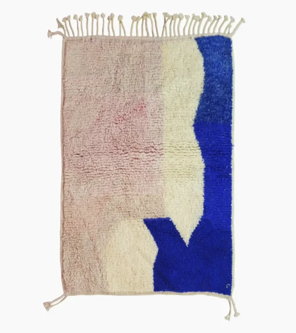 Top View of Rima handmade Beni Ourain wool rug with a contemporary abstract design in multicolor hues including blush pink, off-white, and royal blue to indigo