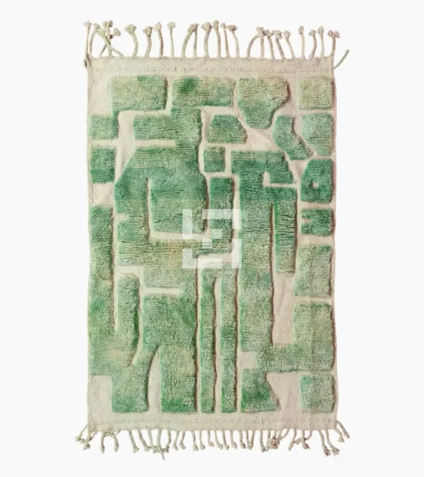 Top View of Ruby handmade Moroccan wool rug with a textured, raised abstract design in green and ivory