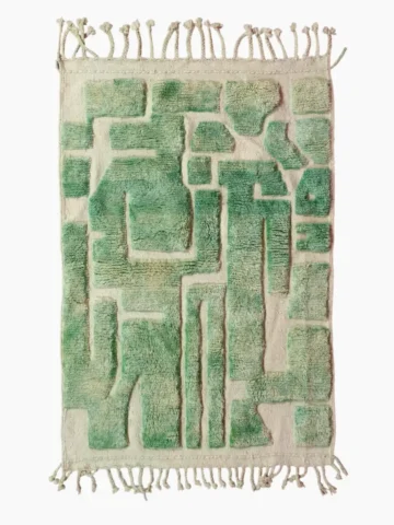 Top View of Ruby handmade Moroccan wool rug with a textured, raised abstract design in green and ivory