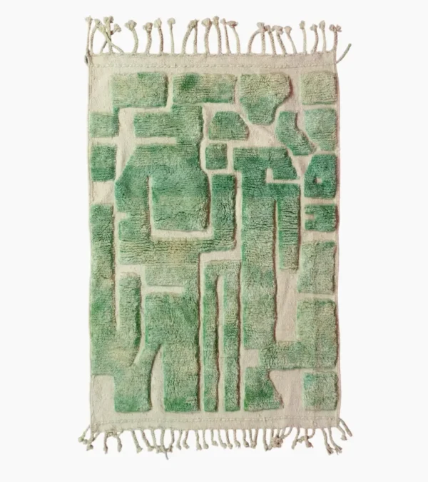 Top View of Ruby handmade Moroccan wool rug with a textured, raised abstract design in green and ivory