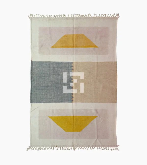 Top View of Sana handmade Kilim flatweave wool rug with color blocks in off-white, teal, and beige, with yellow trapezoids