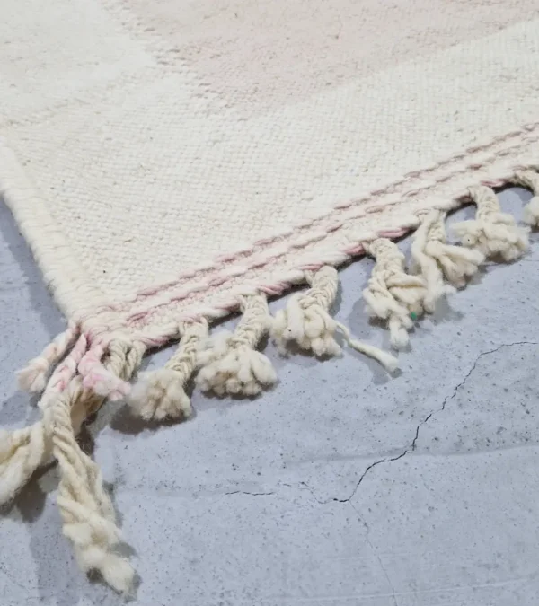 Detailed View of Sana handmade Kilim flatweave wool rug with color blocks in off-white, teal, and beige, with yellow trapezoids