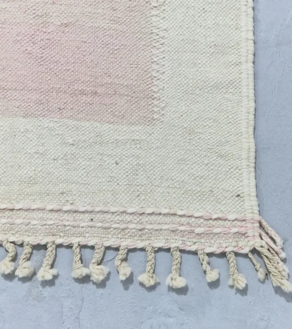 Detailed View of Sana handmade Kilim flatweave wool rug with color blocks in off-white, teal, and beige, with yellow trapezoids