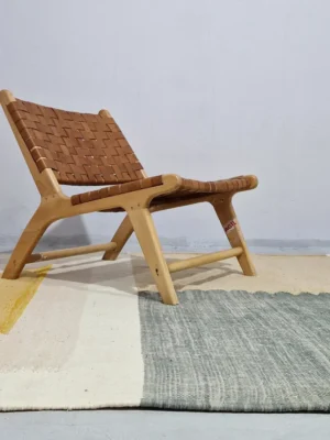 Sana handmade Kilim flatweave wool rug with color blocks in off-white, teal, and beige, with yellow trapezoids in room