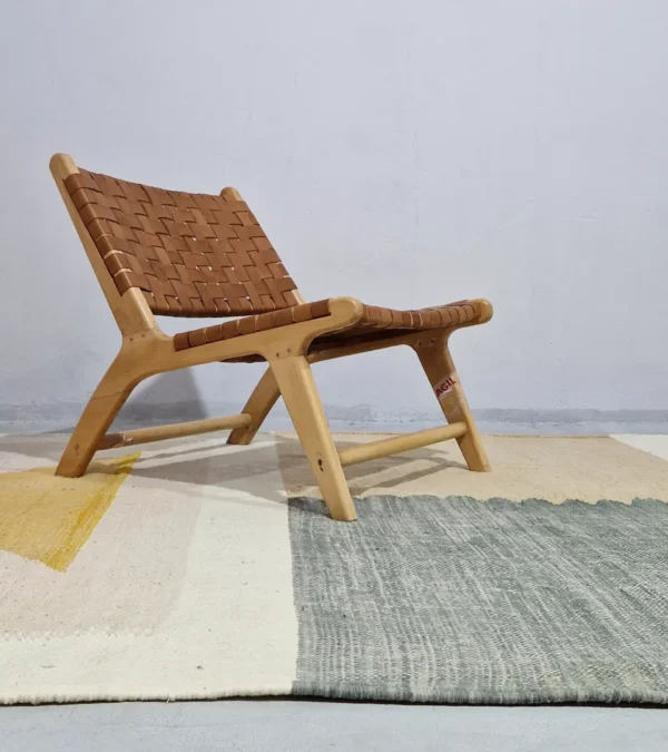 Sana handmade Kilim flatweave wool rug with color blocks in off-white, teal, and beige, with yellow trapezoids in room