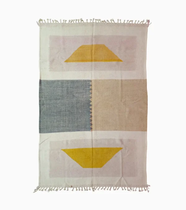 Top View of Sana handmade Kilim flatweave wool geometric rug with color blocks in off-white, teal, and beige, with yellow trapezoids