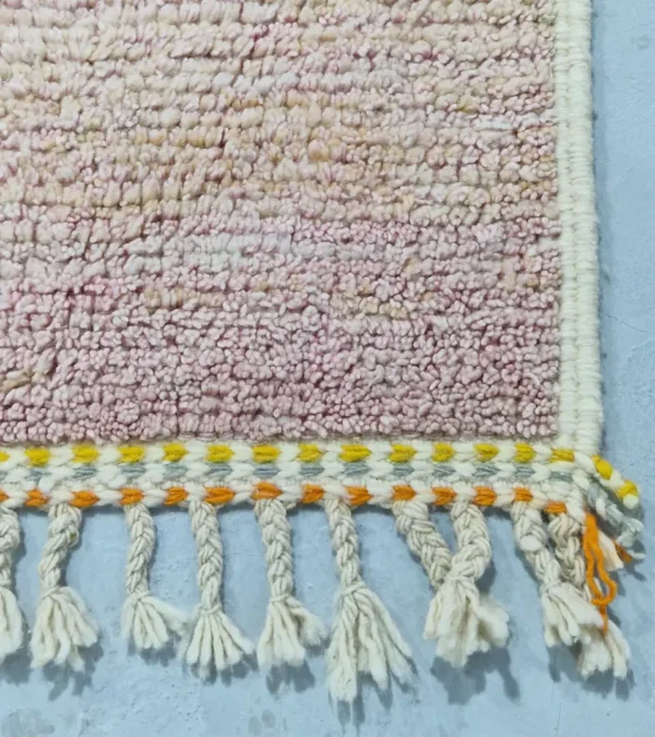 Detailed View of Sanaa handmade Beni Ourain wool rug with a contemporary abstract design in multicolor hues including lavender, grayish-green, mustard yellow, dark teal, and golden brown