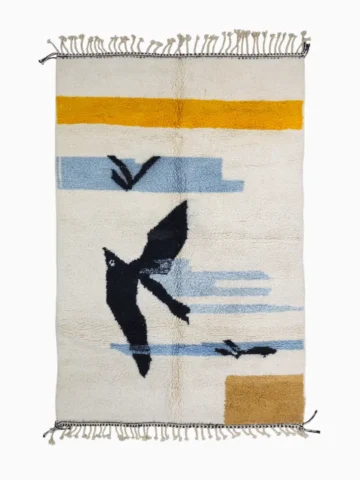top view of Sofia handmade Moroccan wool rug with a minimalist design of abstract birds in flight