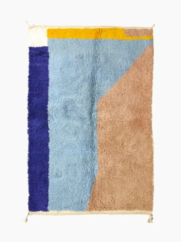 Top View of Handmade Moroccan wool rug with a geometric color-block design in blue, orange, and yellow