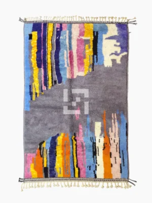 Top View of Handmade Moroccan wool rug with an abstract skyline design in multi-color on a gray background
