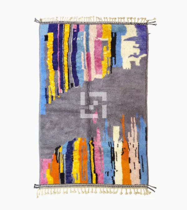 Top View of Handmade Moroccan wool rug with an abstract skyline design in multi-color on a gray background