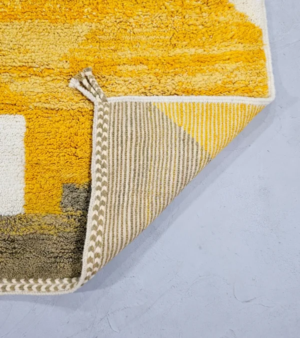 Detailed View of Soma handmade Beni Ourain wool rug with abstract color blocks in mustard yellow and brown