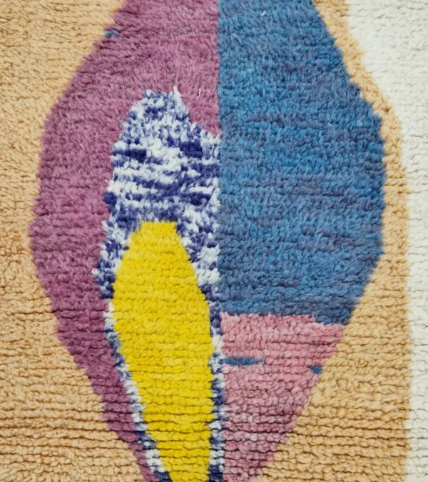 Detailed View of Soraya handmade Azilal wool runner with an abstract geometric design in pink, yellow, blue, and navy