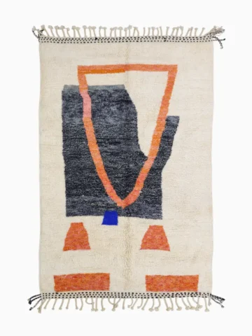 Top View of Soraya handmade Beni Ourain wool rug with a minimalist geometric design in dark gray, burnt orange, and bright blue on an ivory background
